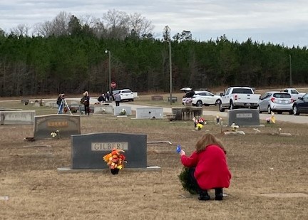 Wreath being laid by family member at Overbrook Cemetery