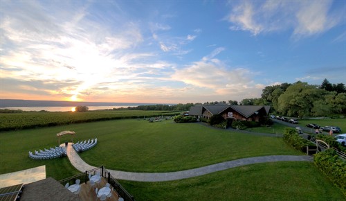 Gallery Image sunset-on-lake-behind-winery-and-cafe-wedding-setup.jpg