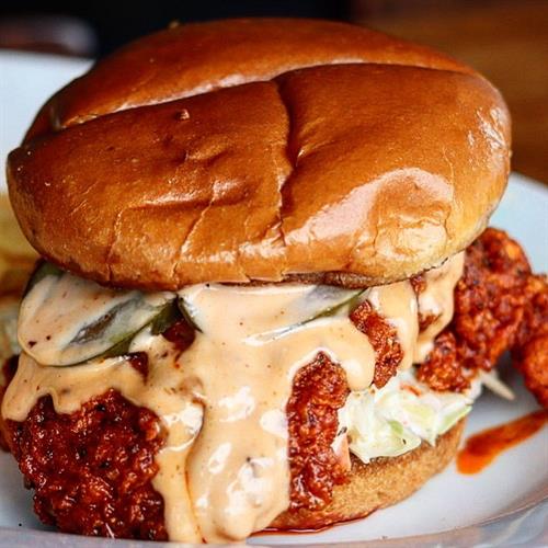 Try our Nashville hot chicken sandwich.  It comes with spicy cayenne brown sugar rub, sweet pickles, coleslaw, comeback sauce.