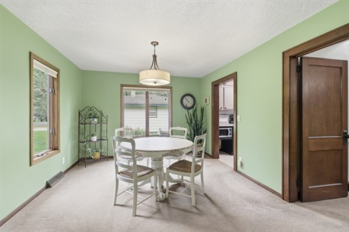Bright dining room with large windows at 525 N Fremont St in River Falls