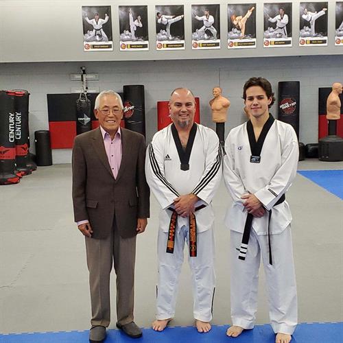 Master Steve Radcliffe and Instructor Adam Radcliffe with Moo Duk Kwan Taekwondo Grandmaster Kyongwon Ahn