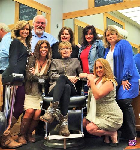 Owner and friend, Donna McLaurin, surrounded by the ones who love her most! She has been cutting hair at Vestavia Barber Shop since 1978.