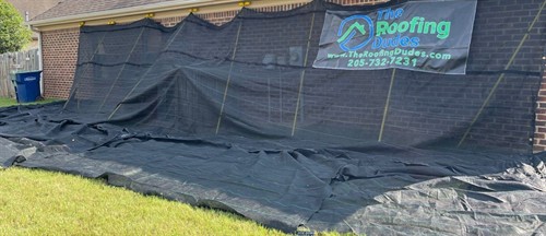 Roofing Dudes protecting a home using a Catch All system