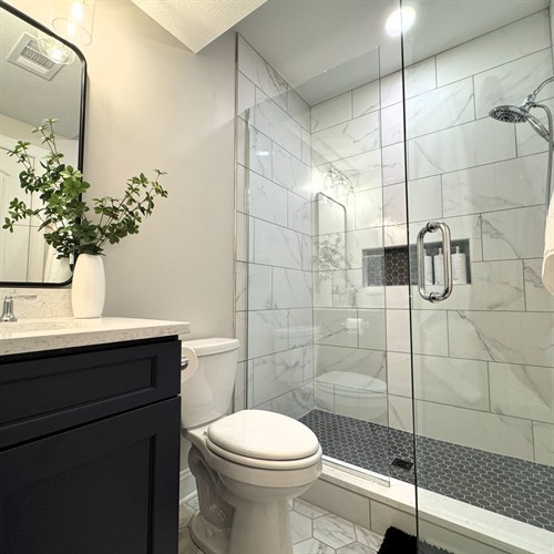 Marble Inspired bathroom with custom shower and vanity
