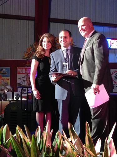 Principal attorney Ronson J. Shamoun and Chief Marketing Officer Renae Arabo accept the 2013 East County Business of the Year award from the San Diego East County Chamber of Commerce.