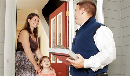 Gallery Image Rose_technician_discusses_plan_with_homeowner.jpg