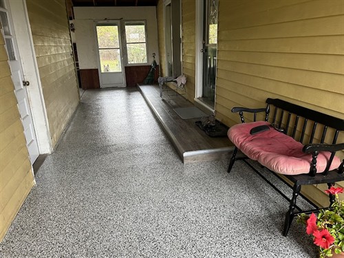 Flake flooring for a breezeway using polyaspartic topcoat