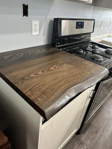 “Organic lines. Artisan hands. One-of-a-kind countertops.”