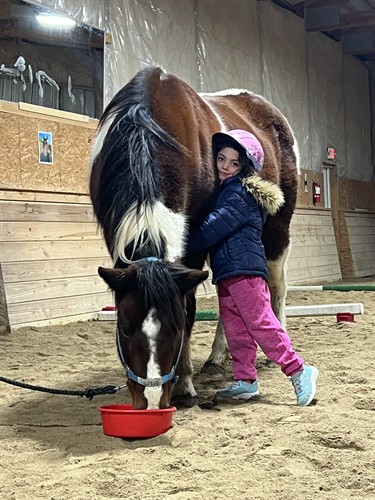 Our client Serya and our therapy horse Charlie sharing a sweet moment 