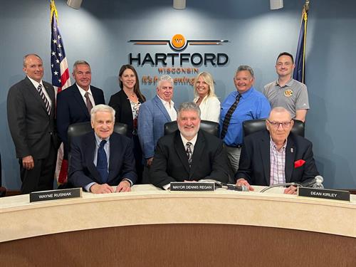 Elected officials of Hartford. Left back, Chad Waldvogel (Alderperson, 2nd District), Joe Kohler (Alderperson, 1st District), Erin Wilk (Alderperson, 1st District), Jeff Turchi (Alderperson, 1st District), Tina Savage (Alderperson, 3rd District), Tony Garza (Alderperson, 3rd District), Justin Webb (Alderperson, 3rd District). Bottom Left, Wayne Rusinak (Council President, 2nd District), Mayor Dennis Regan, Dean Kirley (Alderperson, 2nd District). Elected officials of Hartford. Left back, Chad Waldvogel (Alderperson, 2nd District), Joe Kohler (Alderperson, 1st District), Erin Wilk (Alderperson, 1st District), Jeff Turchi (Alderperson, 1st District), Tina Savage (Alderperson, 3rd District), Tony Garza (Alderperson, 3rd District), Justin Webb (Alderperson, 3rd District). Bottom Left, Wayne Rusinak (Council President, 2nd District), Mayor Dennis Regan, Dean Kirley (Alderperson, 2nd District).