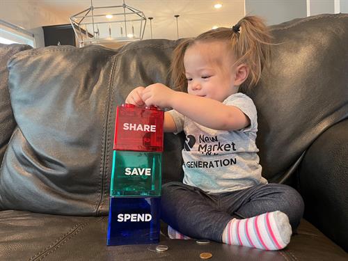 Stop in to open a children's savings and get a Share, Save, Spend bank.