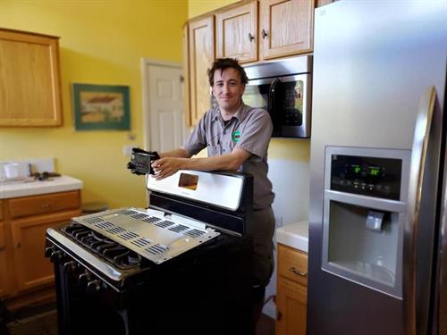 Gallery Image Shane_repairing_stove.jpg