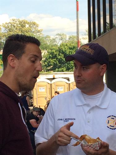 Fire Chief John Morrison is interviewed by Noah Cappe from Carnival Eats, Food Network