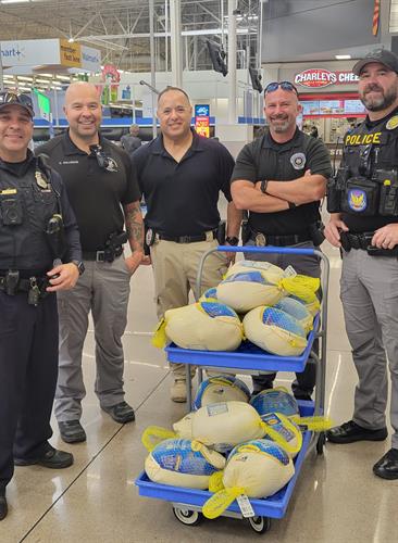 Officers purchasing turrkeys for families to celebrate Thanksgiving