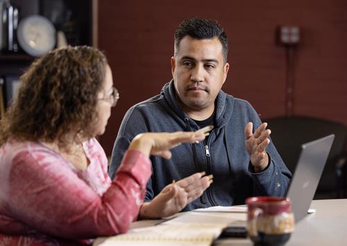 A Build WyCo housing counselor works with a customer on his homeownership goals.