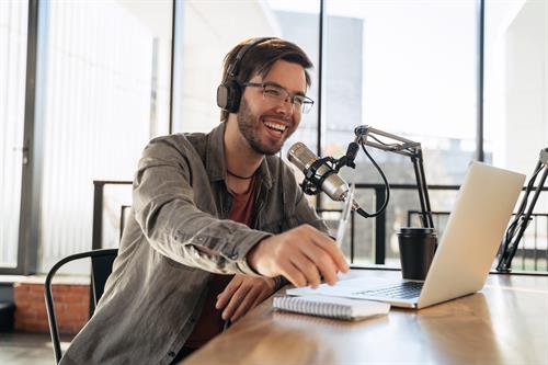 Gallery Image AdobeStock_469781463_Male_Podcaster.jpeg Gallery Image AdobeStock_469781463_Male_Podcaster.jpeg