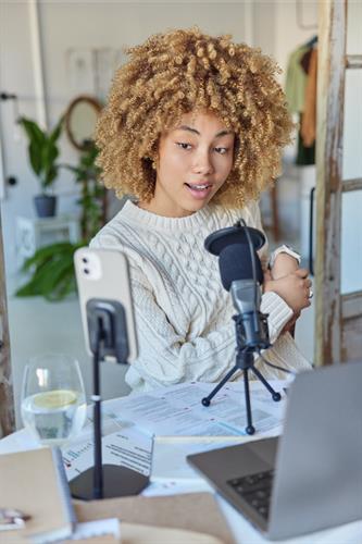 Gallery Image AdobeStock_612053809_Female_Podcaster.jpeg Gallery Image AdobeStock_612053809_Female_Podcaster.jpeg