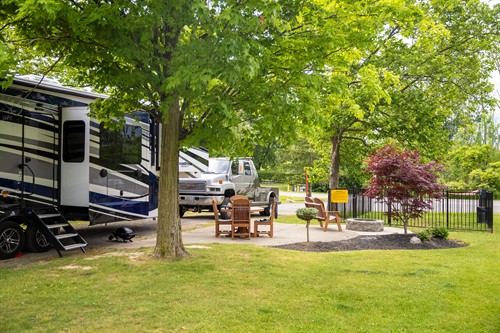 RV with Patio, grill, furniture, and fire ring