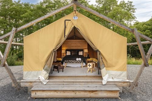Safari tent with one queen bed and in-tent bathroom