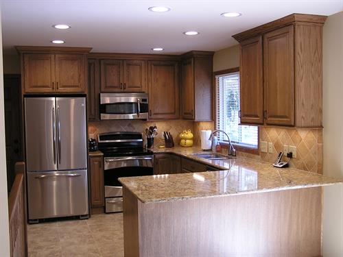 Kitchen with Oak Cabinetry and Cambria Countertops