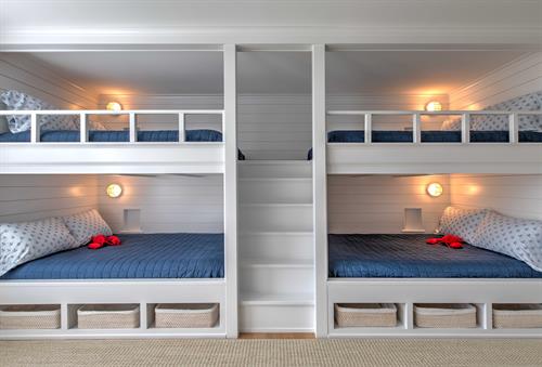 Custom bunk beds easily accessed with center stairs