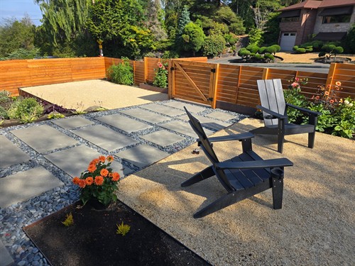 Custom hardscaping and cedar fencing creating a private, inviting outdoor retreat