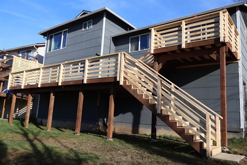 Custom multi-level deck and stair system built for access, safety, and durability