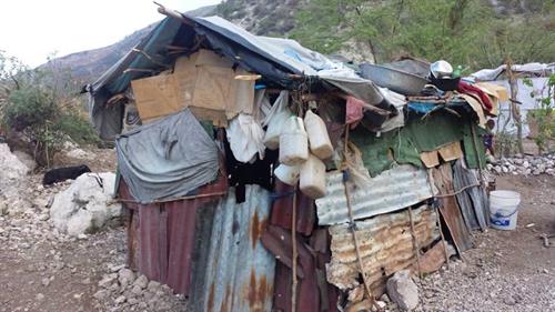 This does not look like much of a house but the family of 4 was found in the mountains living in a cave. A small church built them this shelter and W4H built a 16'x16' concrete house.