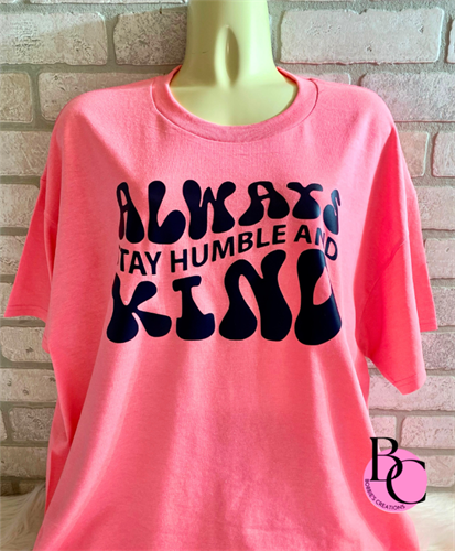 "Always be humble and kind" this black saying really pops on this bright pink t-shirt