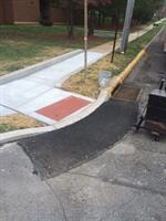 ADA Compliant Ramps with Detectable Warning Surface and Asphalt Repairs