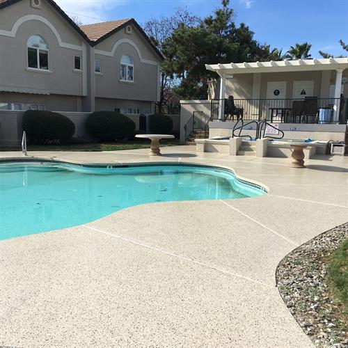 Heat and slip resistant-concrete coatings are beautiful (and safe!) around your pool.