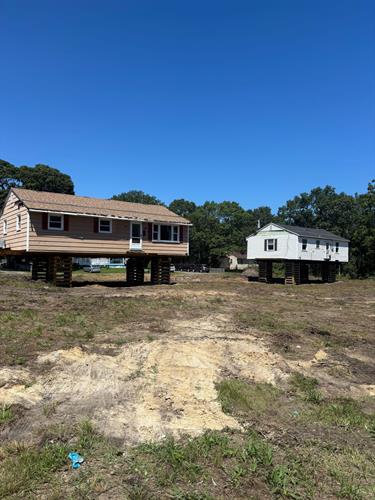 Recent House moves prior to being set on their foundations.