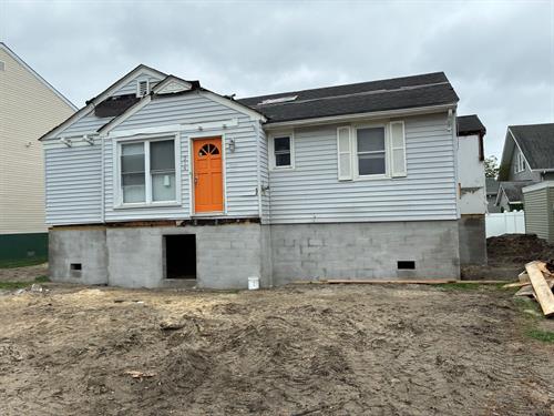 Completed House move set on elevated foundation built by SJ Hauck.