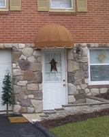 Bullnose style doorhood on a residential door