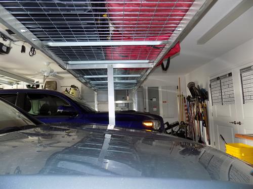 ARackAbove creates a 4’ wide mezzanine across your garage holding 2,000 lbs