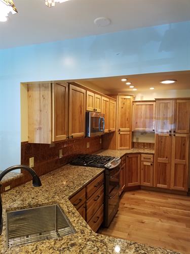 Modern Farmhouse Kitchen with Copper Tile Backsplash, Quartz Countertops, Natural Hiclory Cabinets