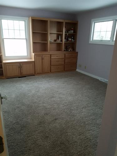 Custom Built-in Natural Oak Cabinets with Window Seat