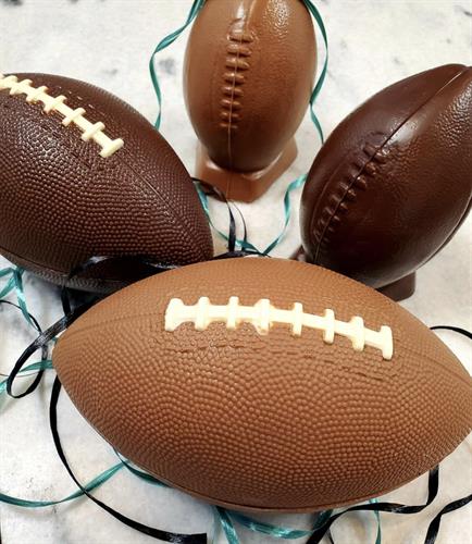 Chocolate footballs stuffed with popcorn Chocolate footballs stuffed with popcorn