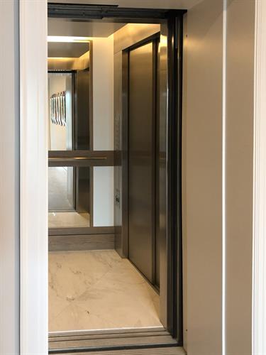 Custom built home elevator with mirrors.