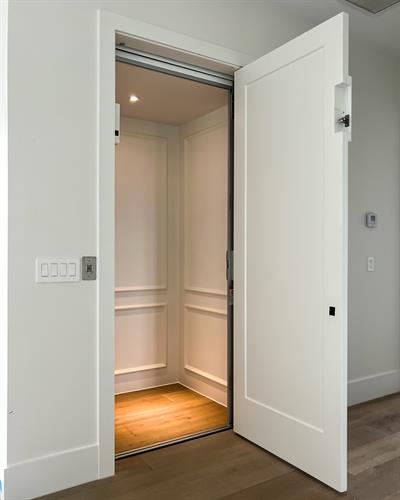 Custom built Peachtree style elevator with paint finish.