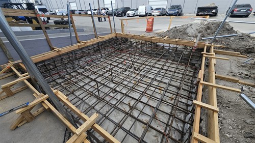 Before the tank goes up, the pad has to be right. Prep work in motion.