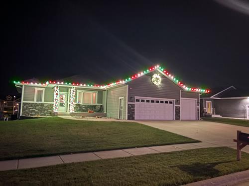 Red/Green/White Holiday Lighting with wreath and column wrap