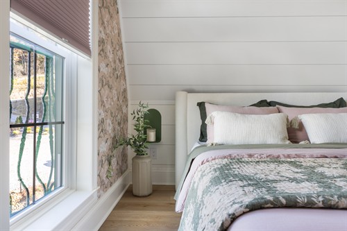 Cellular shades in the bedroom.
