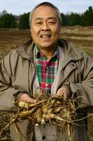 Paul Hsu holding his prize crop