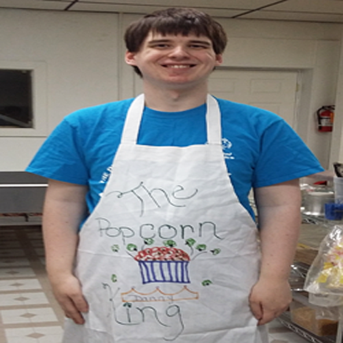 Danny loves showing off his Popcorn King apron