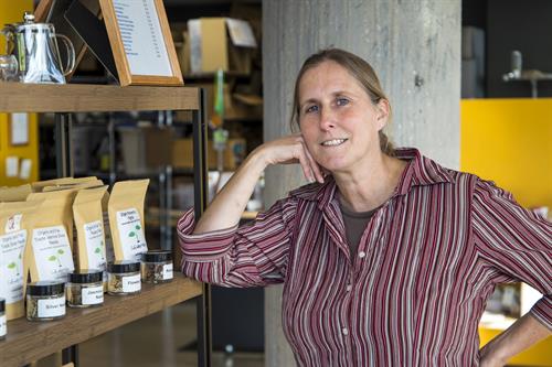 Picture of owner near her white loose leaf teas