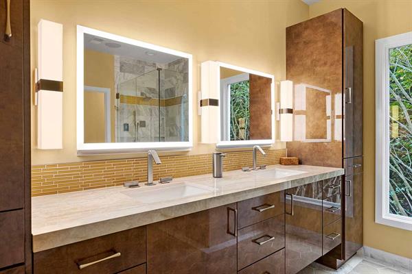 Modern Owners Bathroom Vanity with Vertical Lighting