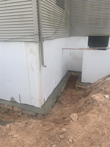 Crumbling foundation replaced with insulated fiberglass wall panels