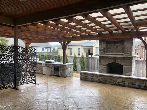 Outdoor Living complete with Outdoor Kitchen, Fireplace sitting area and a Hot tub zone