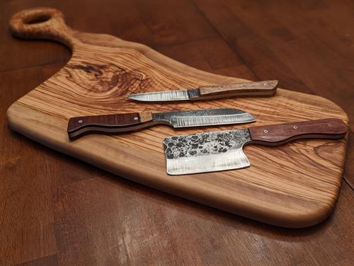 Forged knives on Olivewood Charcuterie Board